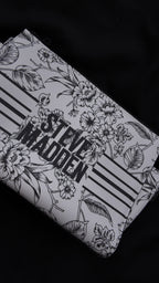 CARTERA STEVE MADDEN FLORAL BLANCO Y NEGRO