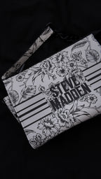 CARTERA STEVE MADDEN FLORAL BLANCO Y NEGRO