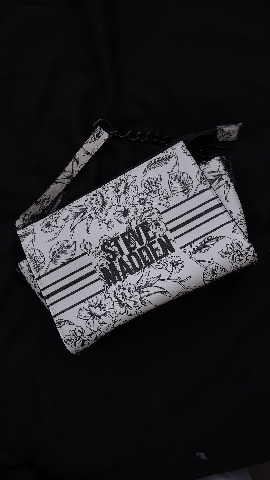 CARTERA STEVE MADDEN FLORAL BLANCO Y NEGRO
