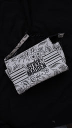 CARTERA STEVE MADDEN FLORAL BLANCO Y NEGRO
